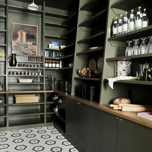 Photo of a transitional l-shaped kitchen pantry in Salt Lake City with open cabinets, green cabinets, multi-coloured floor and brown benchtop.