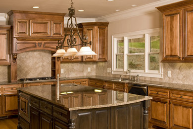 Example of a mid-sized light wood floor kitchen design in Raleigh with a drop-in sink, granite countertops, beige backsplash and an island