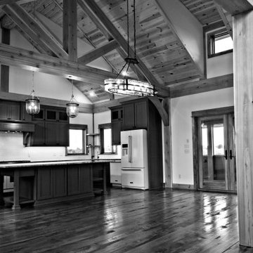 Timber frame kitchen, rustic hardwood floor, large island
