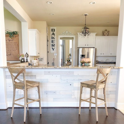 Kitchen - farmhouse dark wood floor and brown floor kitchen idea in Other with raised-panel cabinets, white cabinets, stainless steel appliances and beige countertops