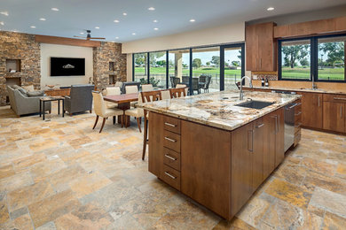 Open concept kitchen - mid-sized traditional travertine floor and beige floor open concept kitchen idea in Phoenix with an undermount sink, flat-panel cabinets, dark wood cabinets, granite countertops, beige backsplash, ceramic backsplash, stainless steel appliances, an island and multicolored countertops