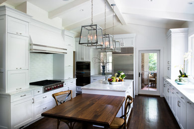 Eat-in kitchen - transitional dark wood floor eat-in kitchen idea in Atlanta with beaded inset cabinets, white cabinets, stainless steel appliances and an island