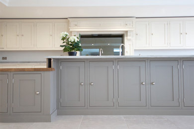 Photo of a large farmhouse grey and cream kitchen in Other with limestone flooring and grey floors.