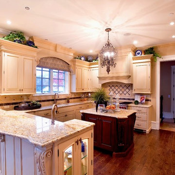 Timeless Kitchen with Bi-Level Counter and Cabinets in Two Finishes