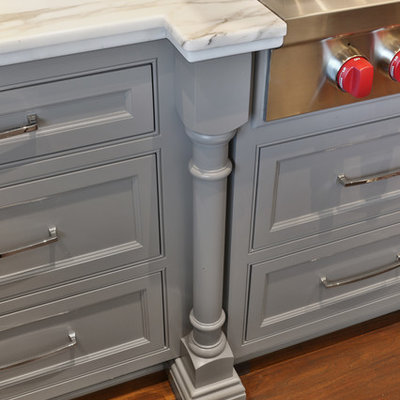 Eat-in kitchen - large traditional u-shaped dark wood floor and brown floor eat-in kitchen idea in Columbus with an undermount sink, beaded inset cabinets, gray cabinets, marble countertops, white backsplash, marble backsplash, paneled appliances, an island and white countertops