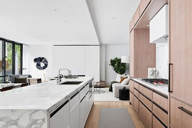 Medium sized contemporary kitchen in New York with an island.