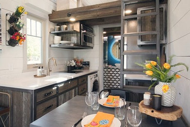 Small traditional single-wall open plan kitchen in Oklahoma City with a submerged sink, flat-panel cabinets, medium wood cabinets, dark hardwood flooring and no island.
