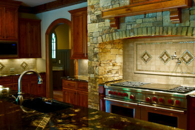 Example of a classic kitchen design in Atlanta with quartzite countertops