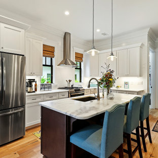Example of a mid-sized transitional kitchen design in Charleston with an island