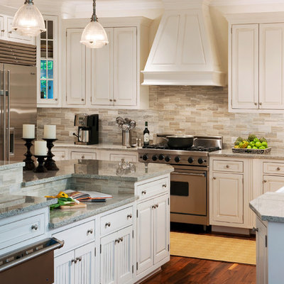 Inspiration for a transitional kitchen remodel in DC Metro with stainless steel appliances, beaded inset cabinets, white cabinets, granite countertops, gray backsplash and travertine backsplash
