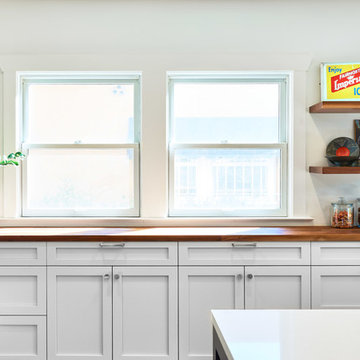 Tons of Storage and Natural Light is this Transformed 1920s Era Kitchen