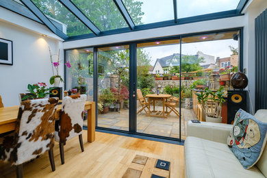 This is an example of a medium sized contemporary open plan kitchen in London.