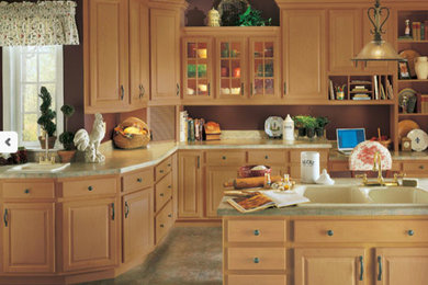 Example of a mid-sized classic l-shaped ceramic tile and multicolored floor enclosed kitchen design in DC Metro with a drop-in sink, raised-panel cabinets, light wood cabinets, granite countertops and an island