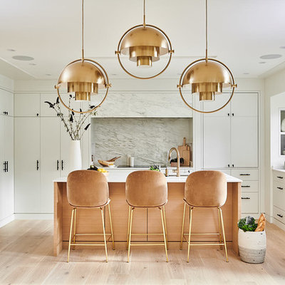 Inspiration for a mid-sized contemporary u-shaped medium tone wood floor and beige floor open concept kitchen remodel in Vancouver with an undermount sink, flat-panel cabinets, white cabinets, marble countertops, white backsplash, marble backsplash, paneled appliances, an island and white countertops