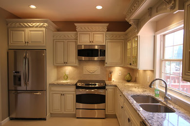 Inspiration for a medium sized traditional l-shaped enclosed kitchen in DC Metro with a submerged sink, raised-panel cabinets, beige cabinets, engineered stone countertops, beige splashback, stone tiled splashback, stainless steel appliances, porcelain flooring, no island and beige floors.