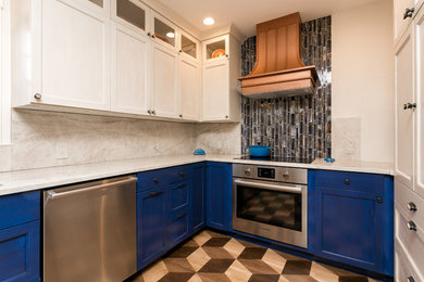 Example of a small transitional l-shaped painted wood floor kitchen design in Charleston with an undermount sink, flat-panel cabinets, blue cabinets, quartzite countertops, multicolored backsplash, glass tile backsplash and stainless steel appliances