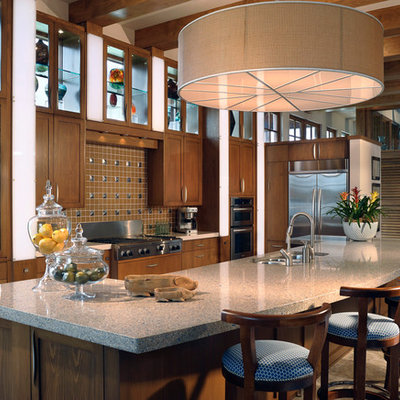 Large island style single-wall porcelain tile and brown floor enclosed kitchen photo in Orlando with an undermount sink, shaker cabinets, dark wood cabinets, quartz countertops, brown backsplash, ceramic backsplash, stainless steel appliances and an island