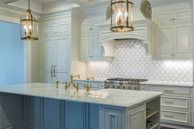 Inspiration for a classic kitchen in Raleigh with white cabinets, marble worktops, white splashback, stone tiled splashback and an island.