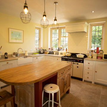 Traditional, bright kitchen with upcycled island