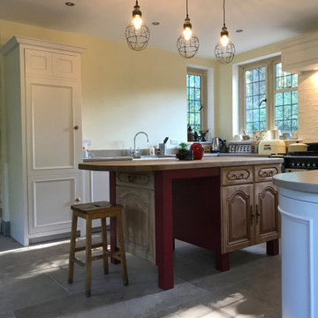 Traditional, bright kitchen with upcycled island
