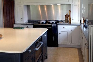 Photo of a large traditional open plan kitchen in Wiltshire with shaker cabinets, white cabinets, granite worktops, metallic splashback, ceramic flooring and an island.