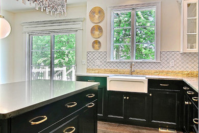 Inspiration for a large timeless u-shaped dark wood floor open concept kitchen remodel in Chicago with a farmhouse sink, recessed-panel cabinets, black cabinets, quartzite countertops, metallic backsplash, stone tile backsplash, stainless steel appliances and an island