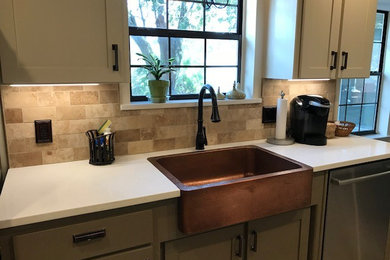 Large elegant u-shaped porcelain tile and beige floor eat-in kitchen photo in Miami with a farmhouse sink, shaker cabinets, gray cabinets, quartz countertops, beige backsplash, travertine backsplash, stainless steel appliances, no island and white countertops