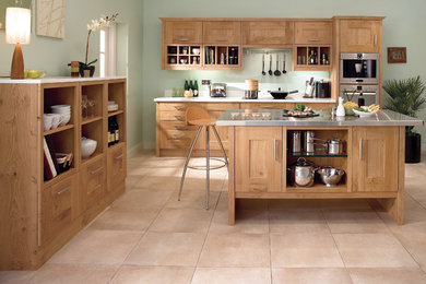 Design ideas for a medium sized traditional l-shaped open plan kitchen in Other with shaker cabinets, medium wood cabinets, stainless steel worktops, stainless steel appliances, ceramic flooring and an island.