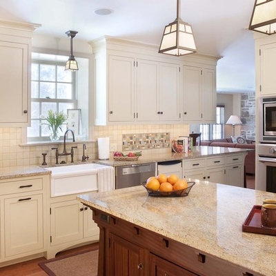 Inspiration for a craftsman kitchen remodel in Philadelphia with mosaic tile backsplash, stainless steel appliances, a farmhouse sink, multicolored backsplash and white cabinets