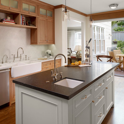 Kitchen - traditional kitchen idea in San Francisco with stainless steel appliances, a farmhouse sink and marble backsplash