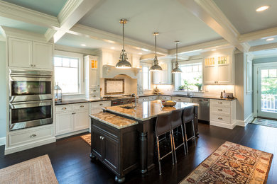 Eat-in kitchen - large traditional l-shaped dark wood floor eat-in kitchen idea in Boston with an undermount sink, recessed-panel cabinets, white cabinets, granite countertops, white backsplash, ceramic backsplash, stainless steel appliances and an island