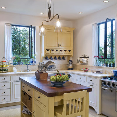 Inspiration for a timeless u-shaped open concept kitchen remodel in Tel Aviv with a drop-in sink, shaker cabinets and white cabinets
