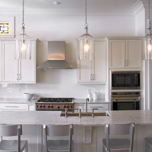 Traditional kitchen photos - Kitchen - traditional kitchen idea in New Orleans with shaker cabinets and marble countertops