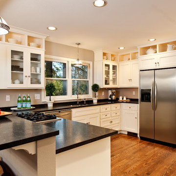 Traditional kitchen with stainless steel, hardwood floors, and granite counterto