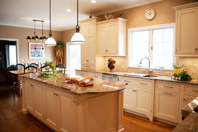 Eat-in kitchen - traditional u-shaped medium tone wood floor eat-in kitchen idea in Vancouver with a double-bowl sink, recessed-panel cabinets, white cabinets, granite countertops, beige backsplash, stone tile backsplash, stainless steel appliances and an island