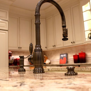 Traditional Mediterranean Kitchen with high-end pull-down faucet in antique pewt