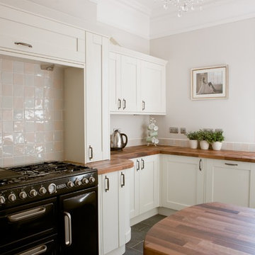 Traditional shaker style kitchen with slate flooring