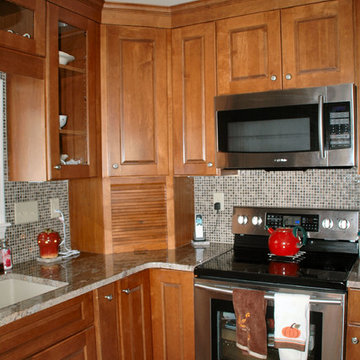 Traditional toffee kitchen remodel with multi-color mosaic tile back-splash