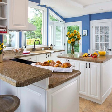 Traditional white kitchen with recycled granite and glass counter top