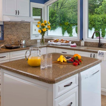 Traditional white kitchen with recycled granite and glass countertop