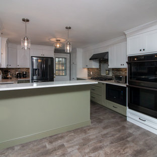 Large traditional eat-in kitchen appliance - Example of a large classic u-shaped vinyl floor and gray floor eat-in kitchen design in Boston with a single-bowl sink, shaker cabinets, white cabinets, quartz countertops, multicolored backsplash, glass sheet backsplash, stainless steel appliances, a peninsula and white countertops