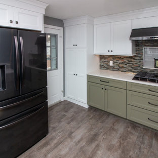 Large traditional eat-in kitchen ideas - Eat-in kitchen - large traditional u-shaped vinyl floor and gray floor eat-in kitchen idea in Boston with a single-bowl sink, shaker cabinets, white cabinets, quartz countertops, multicolored backsplash, glass sheet backsplash, stainless steel appliances, a peninsula and white countertops