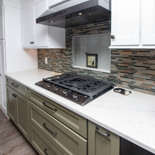 Large traditional eat-in kitchen ideas - Inspiration for a large timeless u-shaped vinyl floor and gray floor eat-in kitchen remodel in Boston with a single-bowl sink, shaker cabinets, white cabinets, quartz countertops, multicolored backsplash, glass sheet backsplash, stainless steel appliances, a peninsula and white countertops