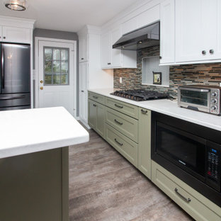 Large traditional eat-in kitchen ideas - Eat-in kitchen - large traditional u-shaped vinyl floor and gray floor eat-in kitchen idea in Boston with a single-bowl sink, shaker cabinets, white cabinets, quartz countertops, multicolored backsplash, glass sheet backsplash, stainless steel appliances, a peninsula and white countertops