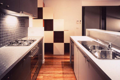 Example of a minimalist kitchen design in Melbourne