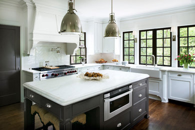 Example of a transitional medium tone wood floor kitchen design in Atlanta with beaded inset cabinets, white backsplash, stainless steel appliances and an island