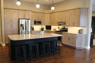 Example of a large transitional l-shaped dark wood floor eat-in kitchen design in Huntington with shaker cabinets, gray cabinets, quartzite countertops, white backsplash, an island, a double-bowl sink, stainless steel appliances and subway tile backsplash