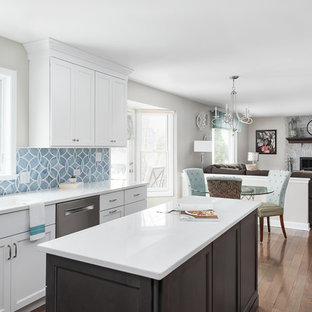 Mid-sized transitional eat-in kitchen ideas - Eat-in kitchen - mid-sized transitional u-shaped dark wood floor and brown floor eat-in kitchen idea in Chicago with an undermount sink, recessed-panel cabinets, white cabinets, quartz countertops, blue backsplash, ceramic backsplash, stainless steel appliances, an island and white countertops
