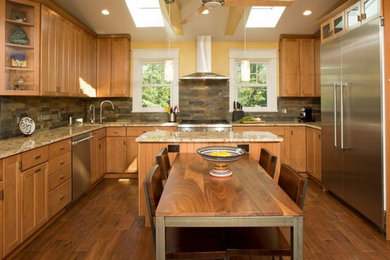 Eat-in kitchen - large transitional u-shaped dark wood floor and brown floor eat-in kitchen idea in Other with an undermount sink, recessed-panel cabinets, beige cabinets, granite countertops, multicolored backsplash, stone tile backsplash, stainless steel appliances and an island