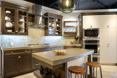 Kitchen - small transitional l-shaped kitchen idea in Phoenix with recessed-panel cabinets, dark wood cabinets, concrete countertops, blue backsplash, ceramic backsplash, stainless steel appliances and an island